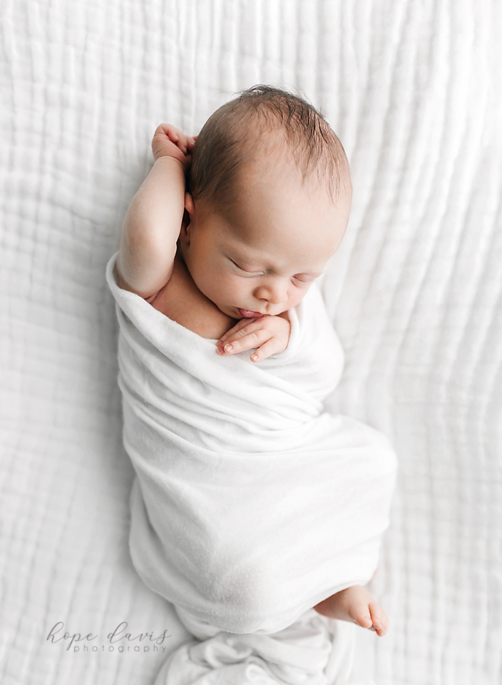 hope davis photography baby wrapped in white blanket